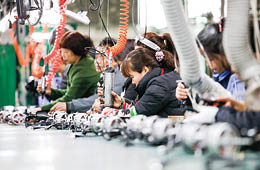 JIUJIANG CHINA-March 17, 2018: workers on the production line of electrical appliances company, Jiujiang, Eastern China  Workers can't relax for a minute, like robots in Chaplin's movie modern times 