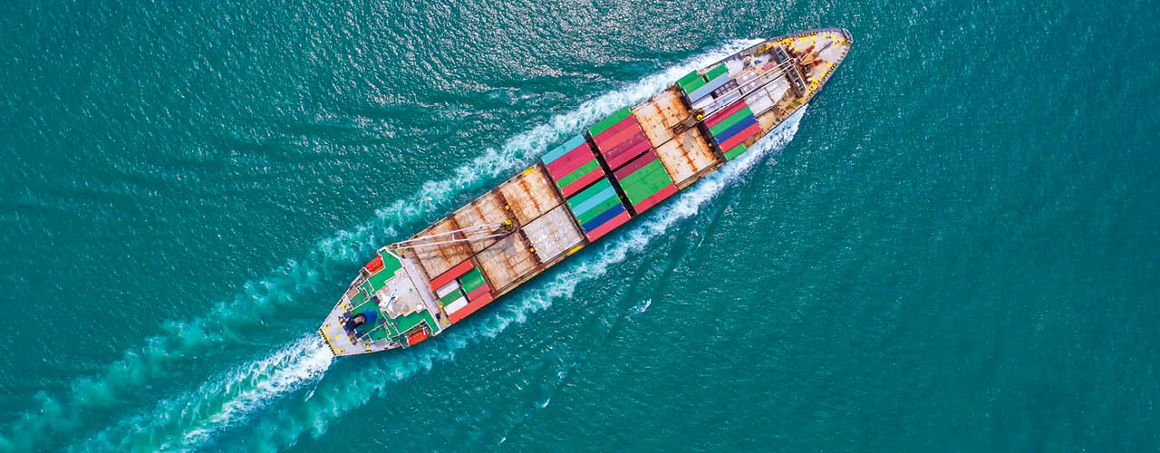 Container ship in export and import business and logistics  Shipping cargo to harbor by crane  Water transport International  Aerial view