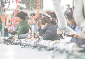 JIUJIANG CHINA-March 17, 2018: workers on the production line of electrical appliances company, Jiujiang, Eastern China  Workers can't relax for a minute, like robots in Chaplin's movie modern times 