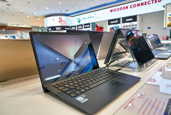 DUBAI, UAE - CIRCA JANUARY 2019: Asus laptops on display at Dubai International Airport 