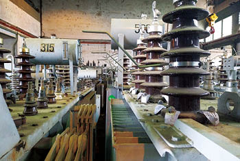 many electrical power transformers stored in a power station