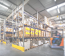 warehouse interior wit blurred forklift and worker in logistic center