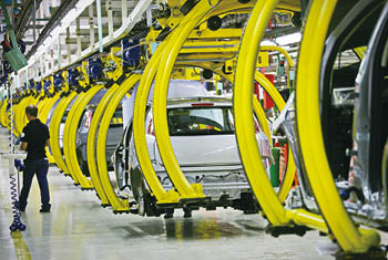 Car production line with unfinished cars in a row at Fca factory   Turin, Italy - May 2012